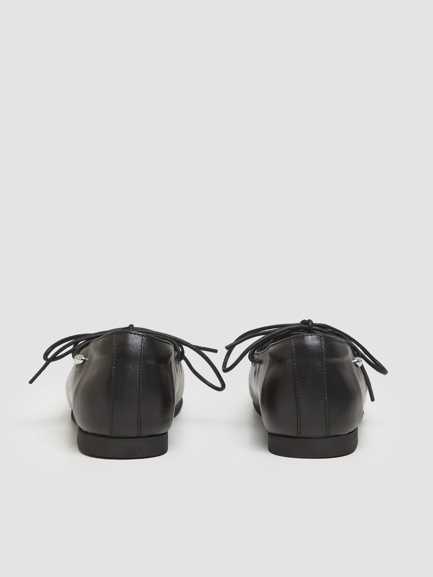 Laced Slip-In Ballerinas in Malleable Black Bull Hide