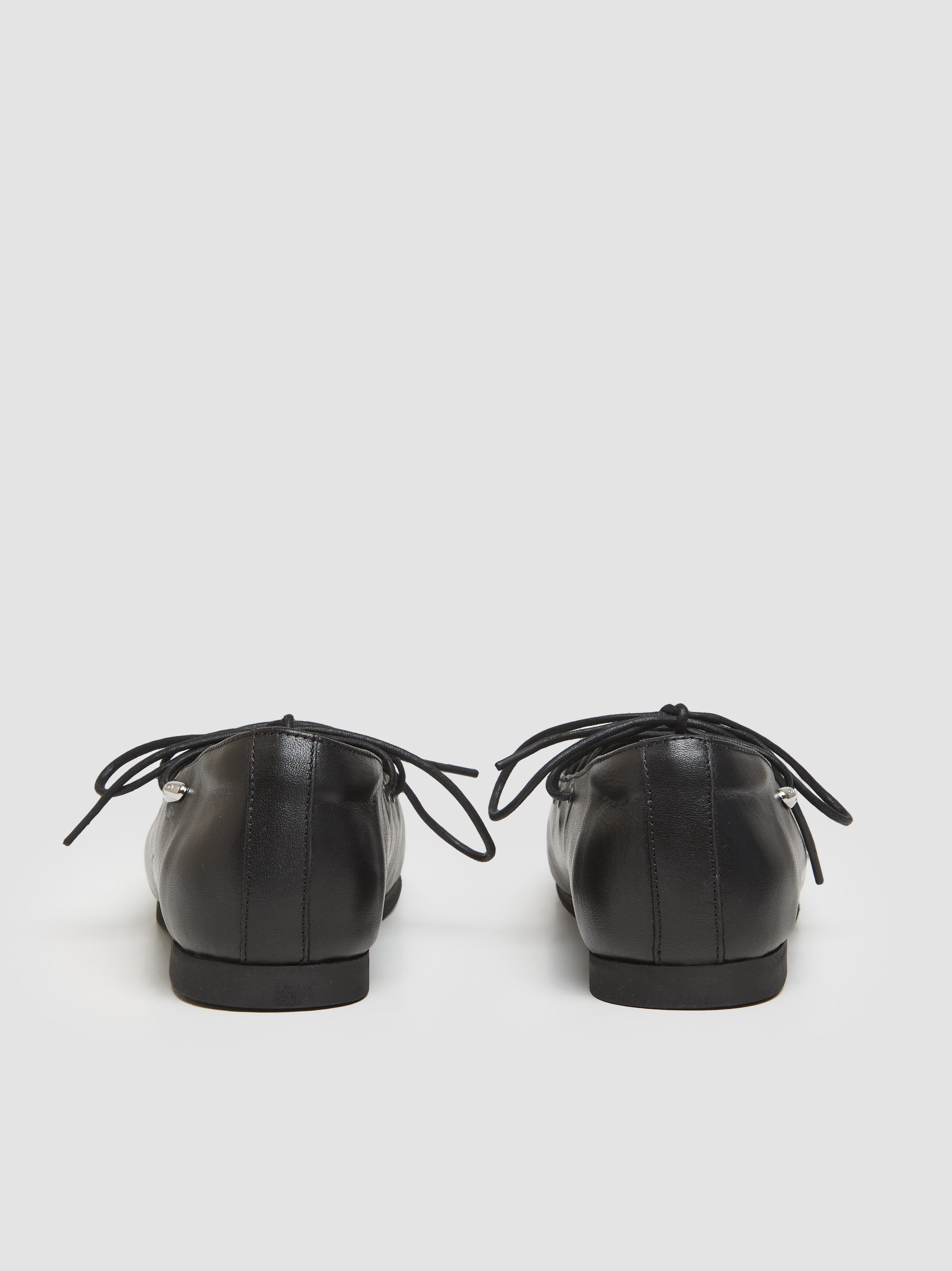 Laced Slip-In Ballerinas in Malleable Black Bull Hide