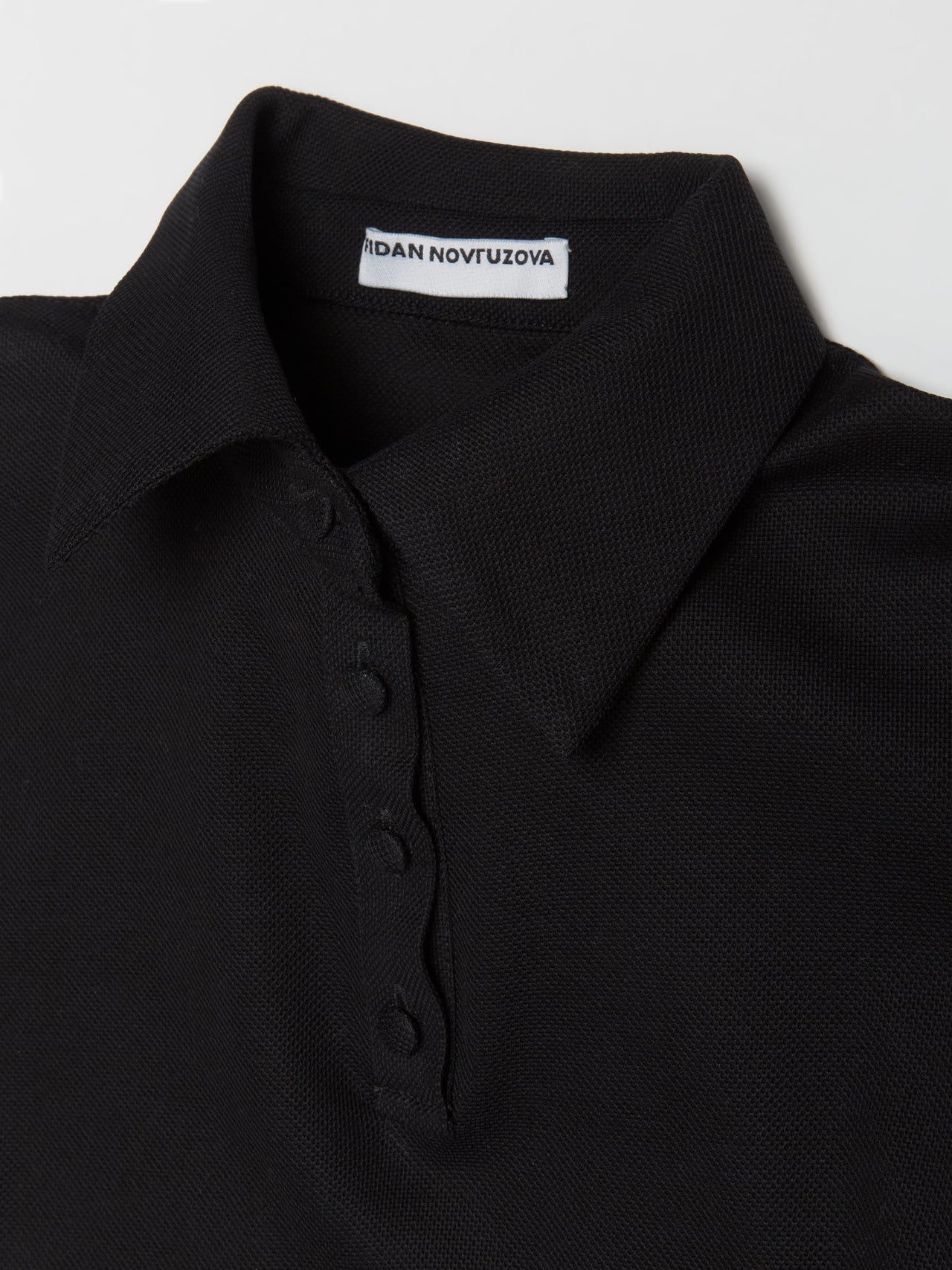 Skye Peplum Polo Shirt in Black