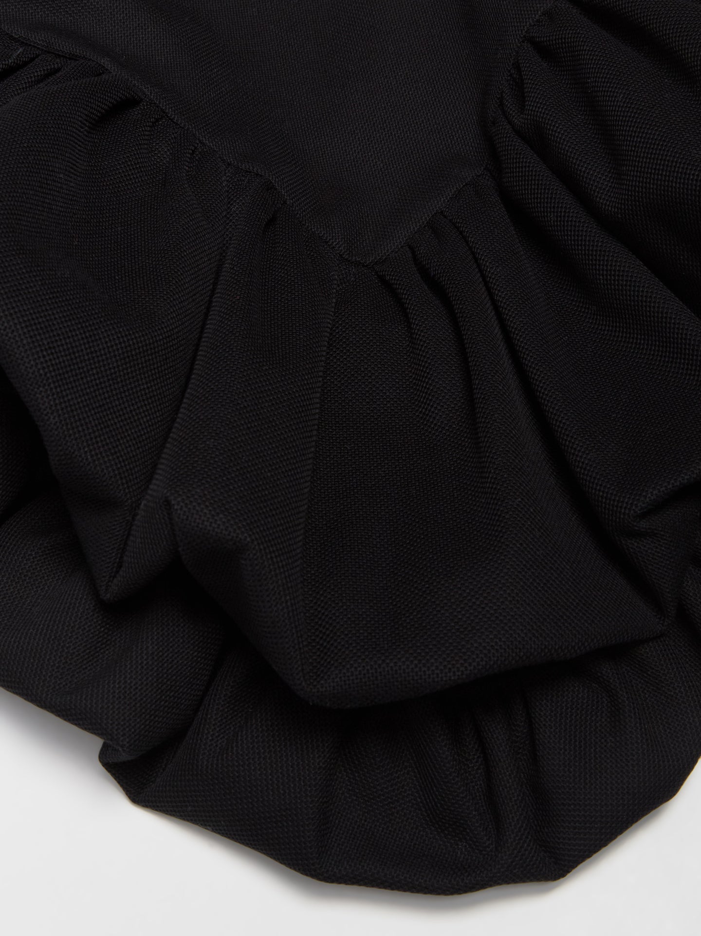 Skye Peplum Polo Shirt in Black