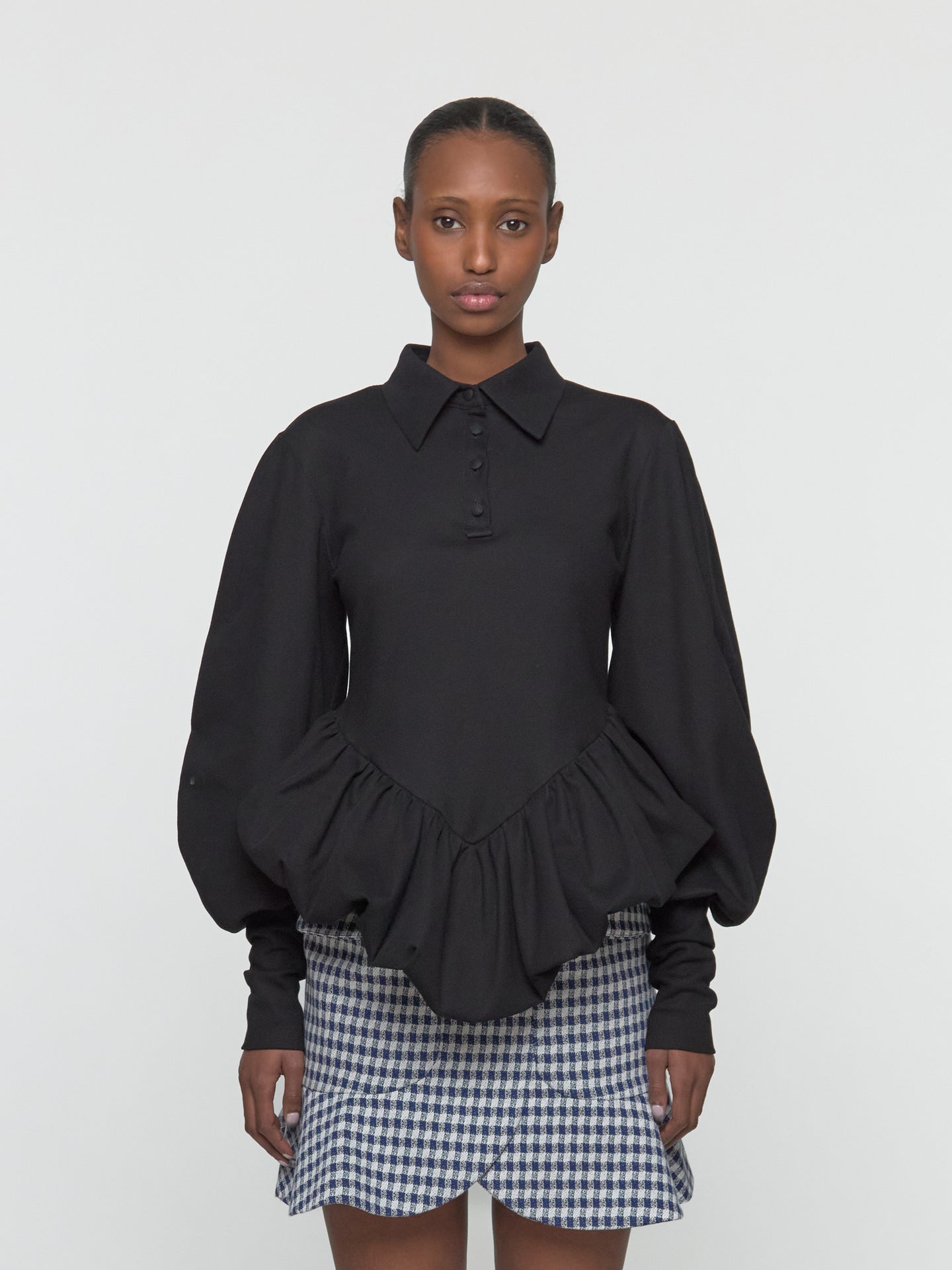 Skye Peplum Polo Shirt in Black