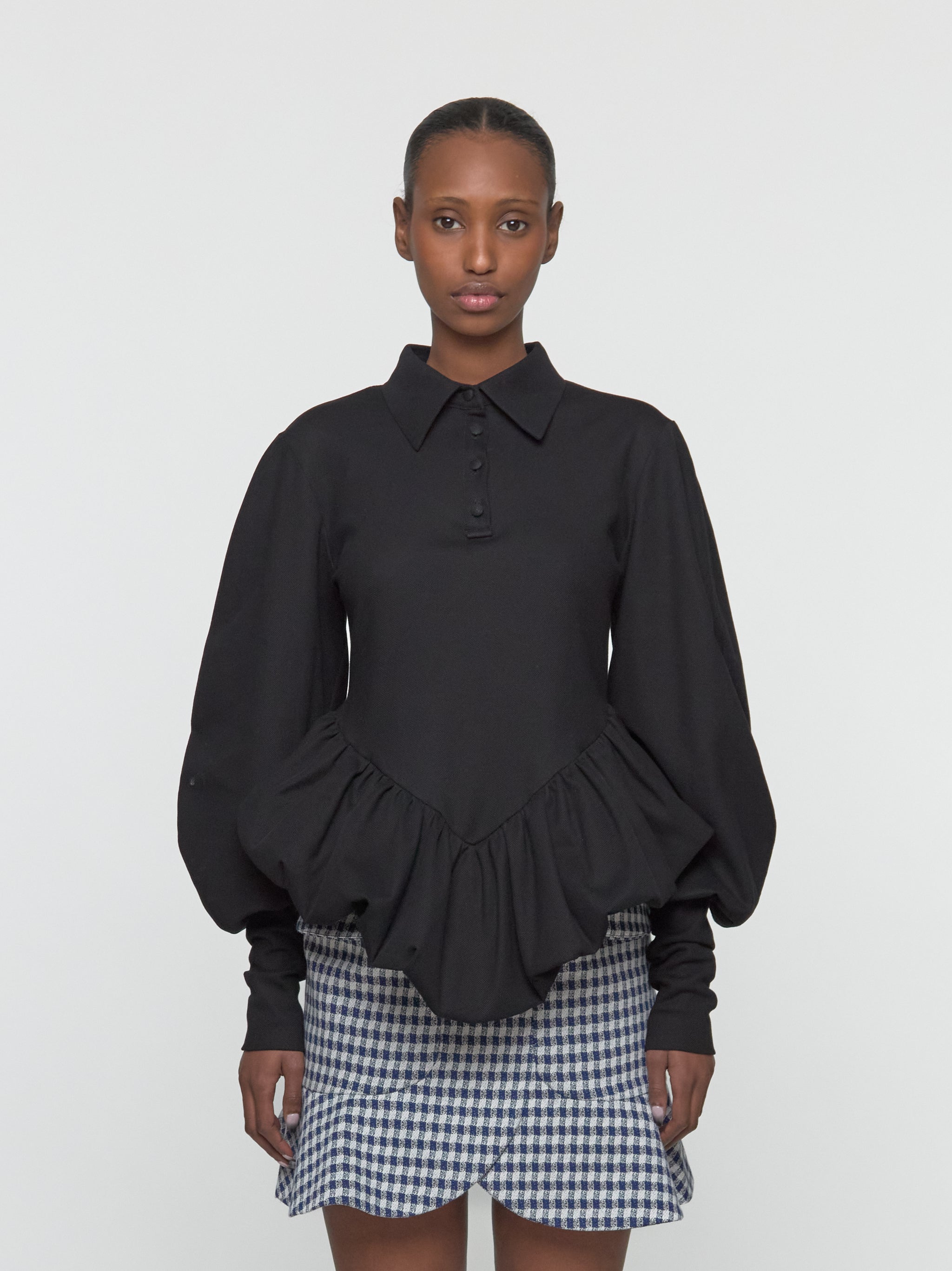 Skye Peplum Polo Shirt in Black