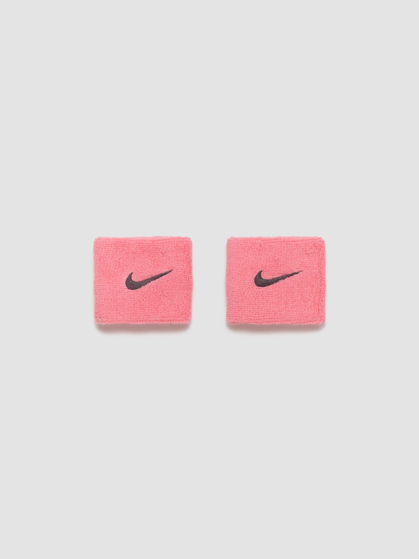 Swoosh Wristbands in Pink Gaze