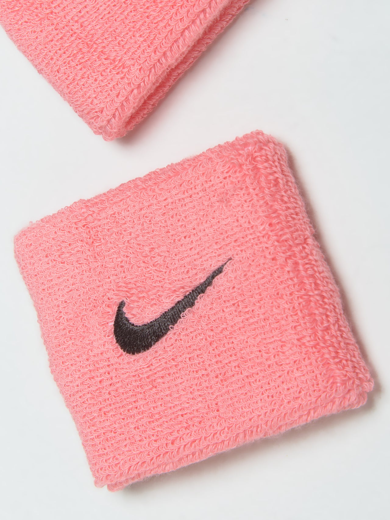 Swoosh Wristbands in Pink Gaze