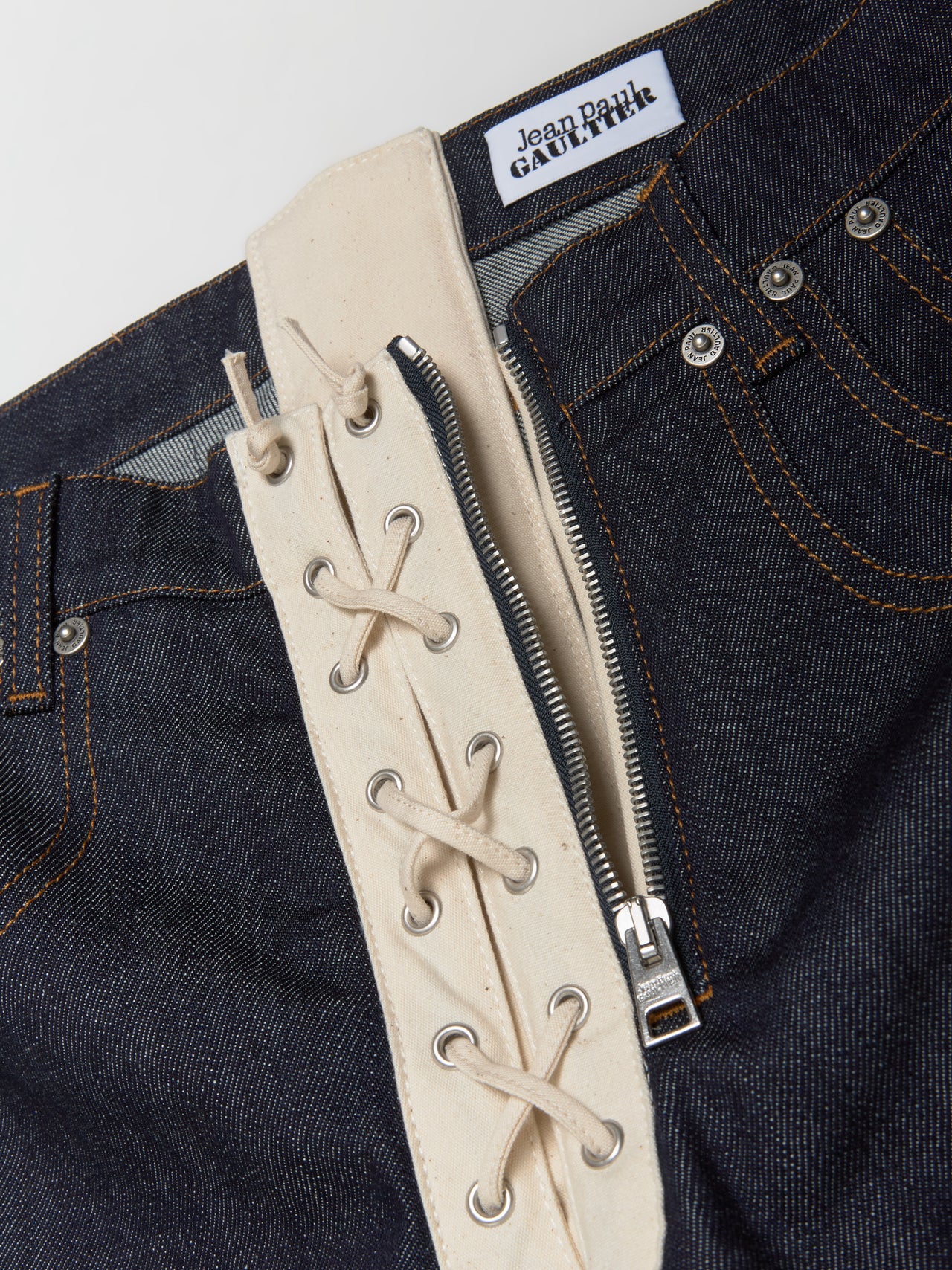 Contrasting Lace-Up Denim Jeans in Indigo