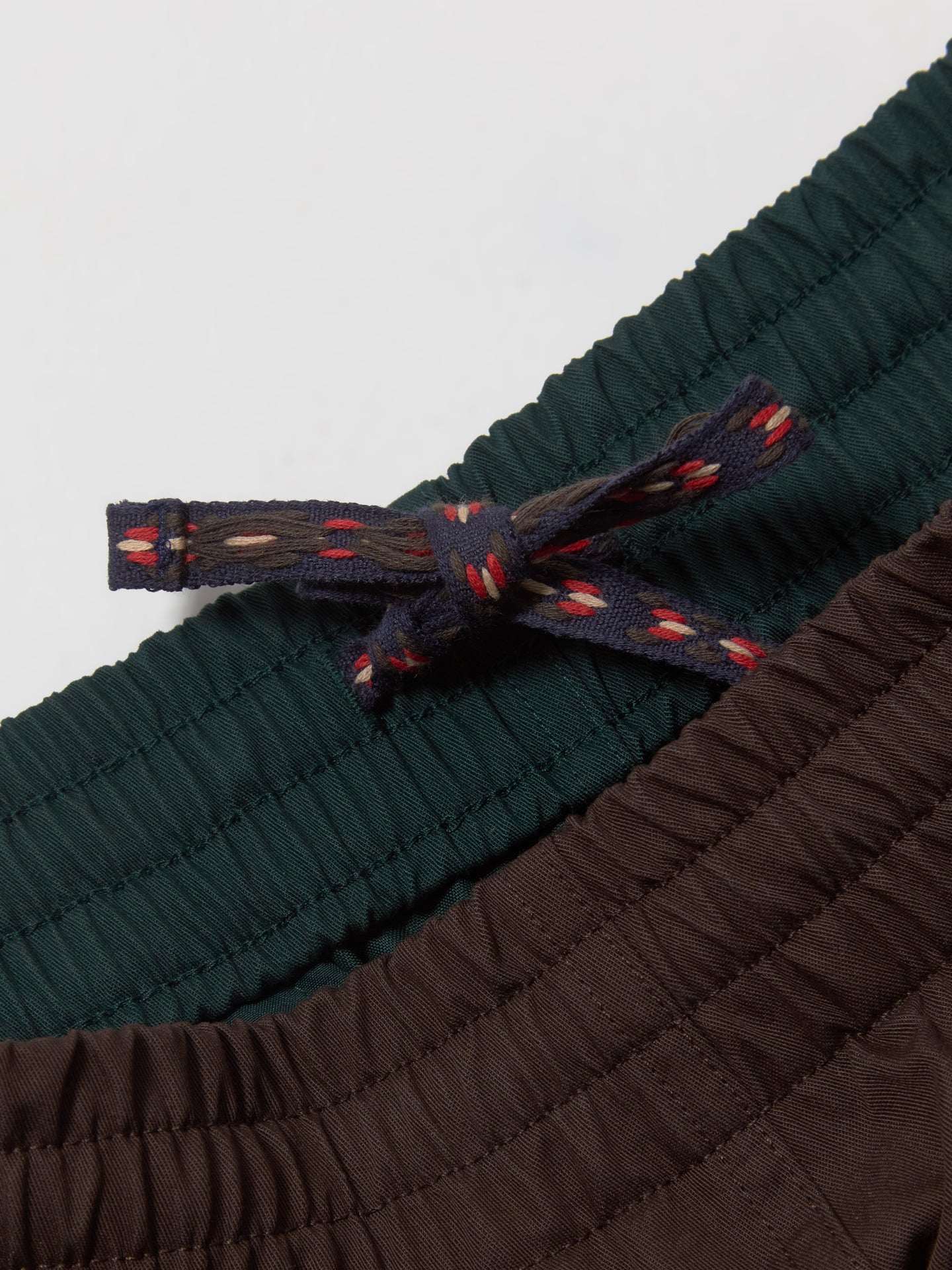 x CLOT Sprinter Shorts in Green Night & Dark Brown