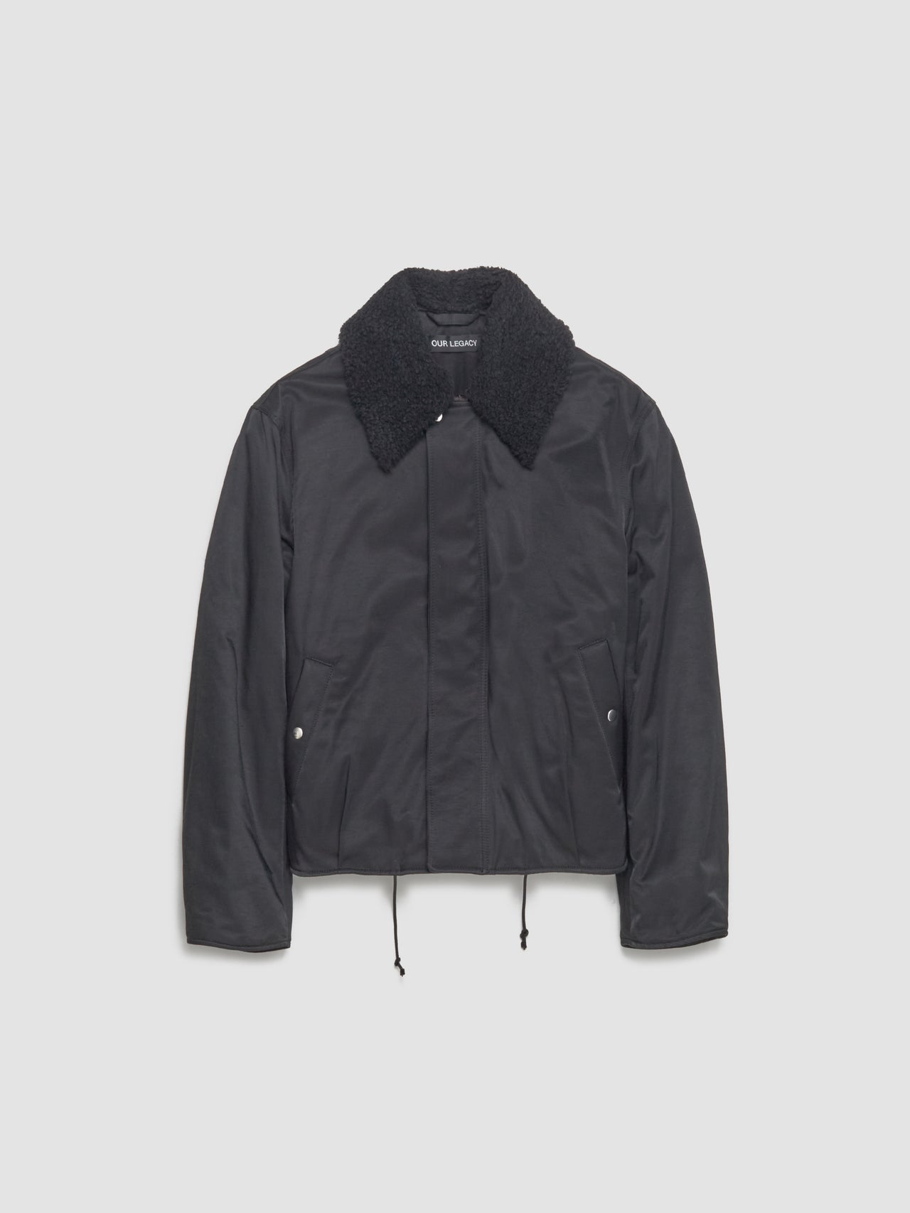 Black jacket with a textured collar on a light gray background