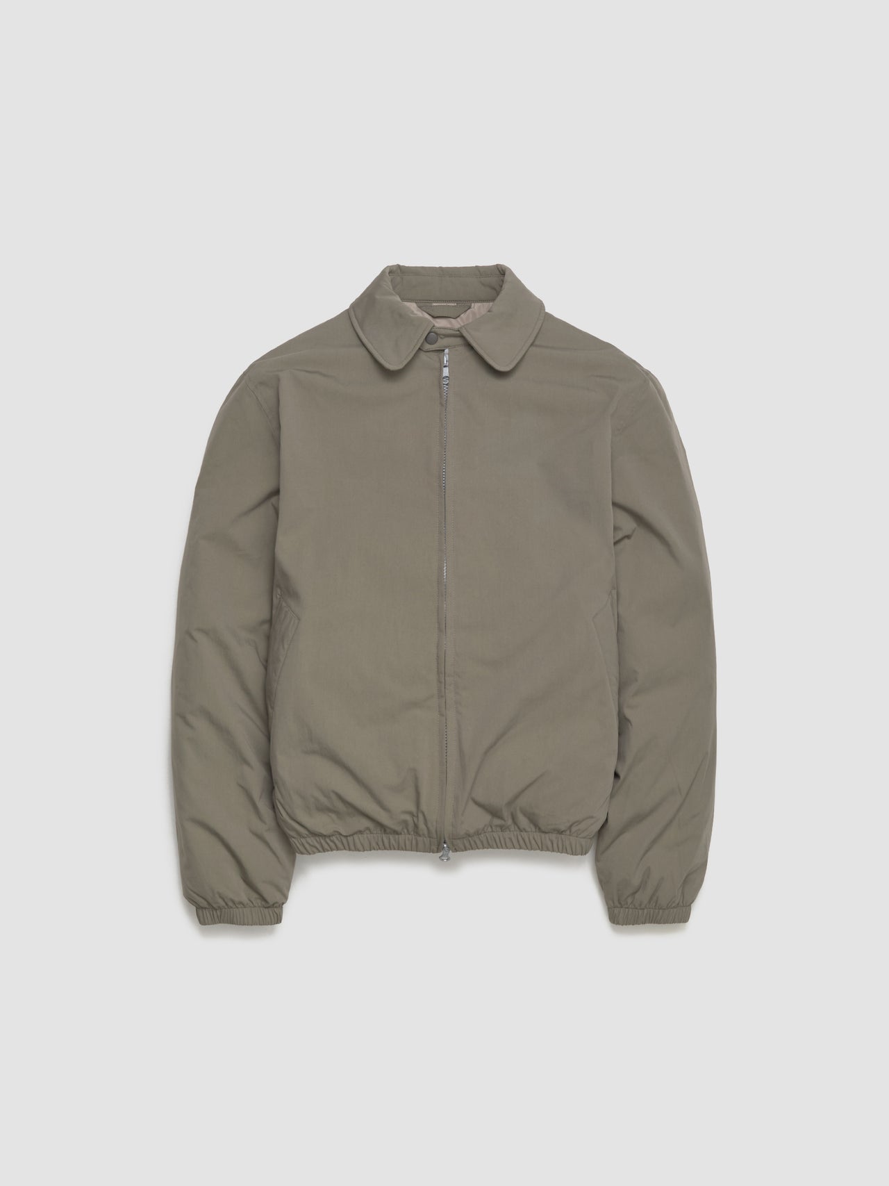 Khaki jacket on a light gray background
