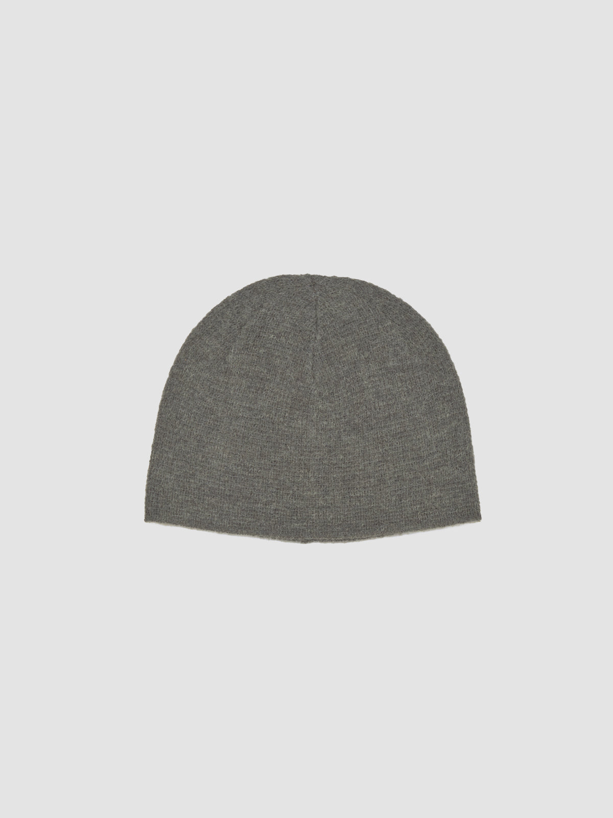 Green beanie on a light gray background