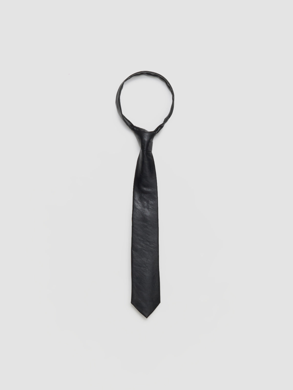 Black tie on a light gray background