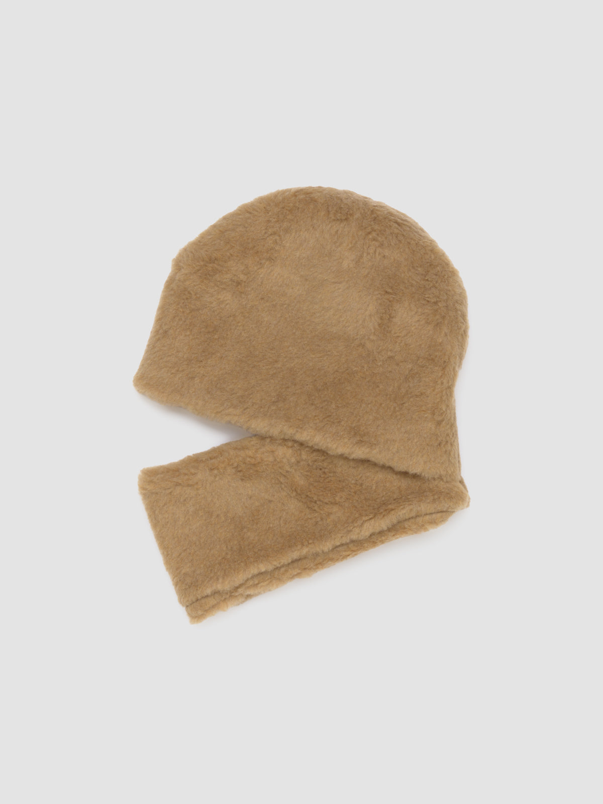 Beige fuzzy snood on a light gray background