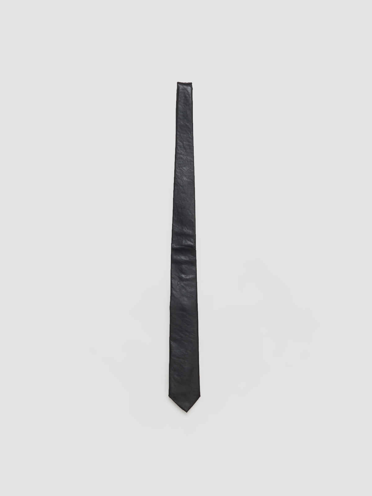 Black tie on a light gray background