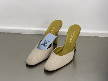Prada beige heel with yellow sole on the ground with 'Shop the Story' card against white background